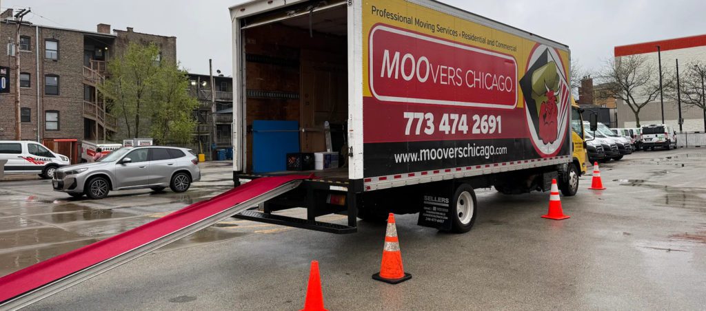 Movers In parking space waiting to be loaded.