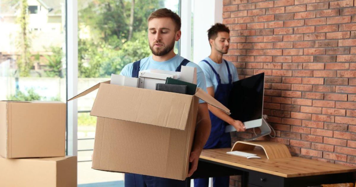 Chicago business movers handling office relocation with moving boxes – professional business moving services