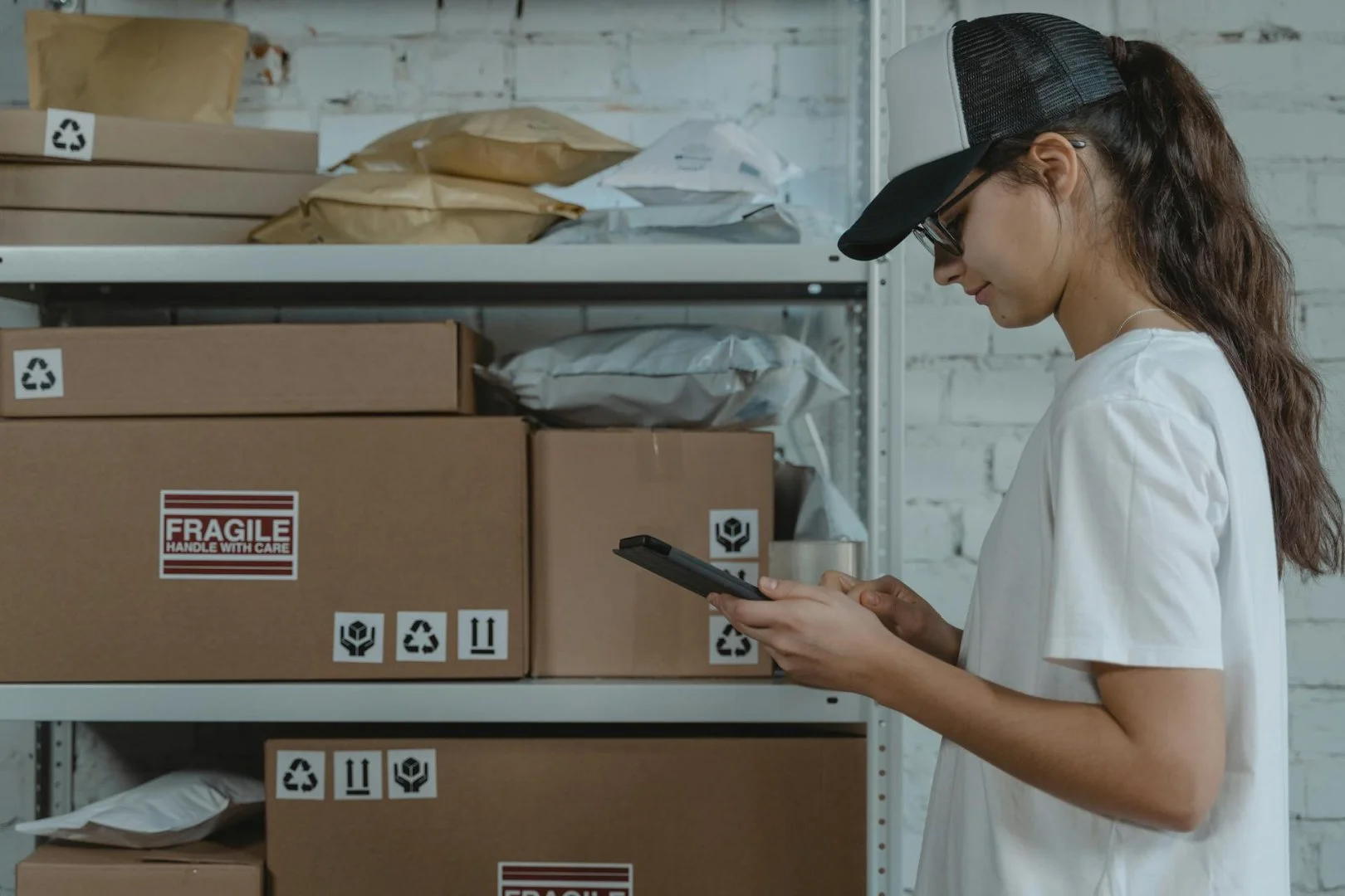 Efficient Moving Services by Moovers Chicago Woman managing moving boxes in a storage area, Moovers Chicago.