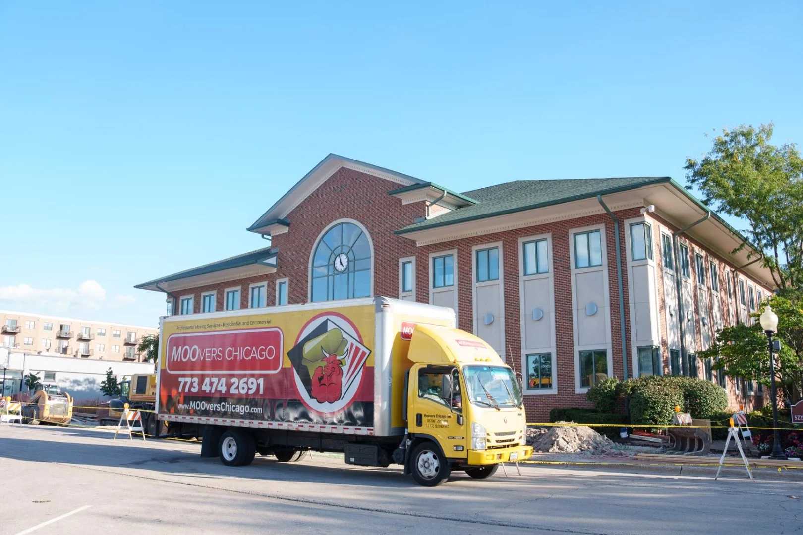 Moovers Chicago Truck at Work Moovers Chicago truck parked in front of a building, local and long distance moving services in Westmont, IL.