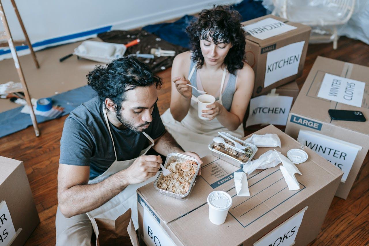 Couple eating off a cardboard box