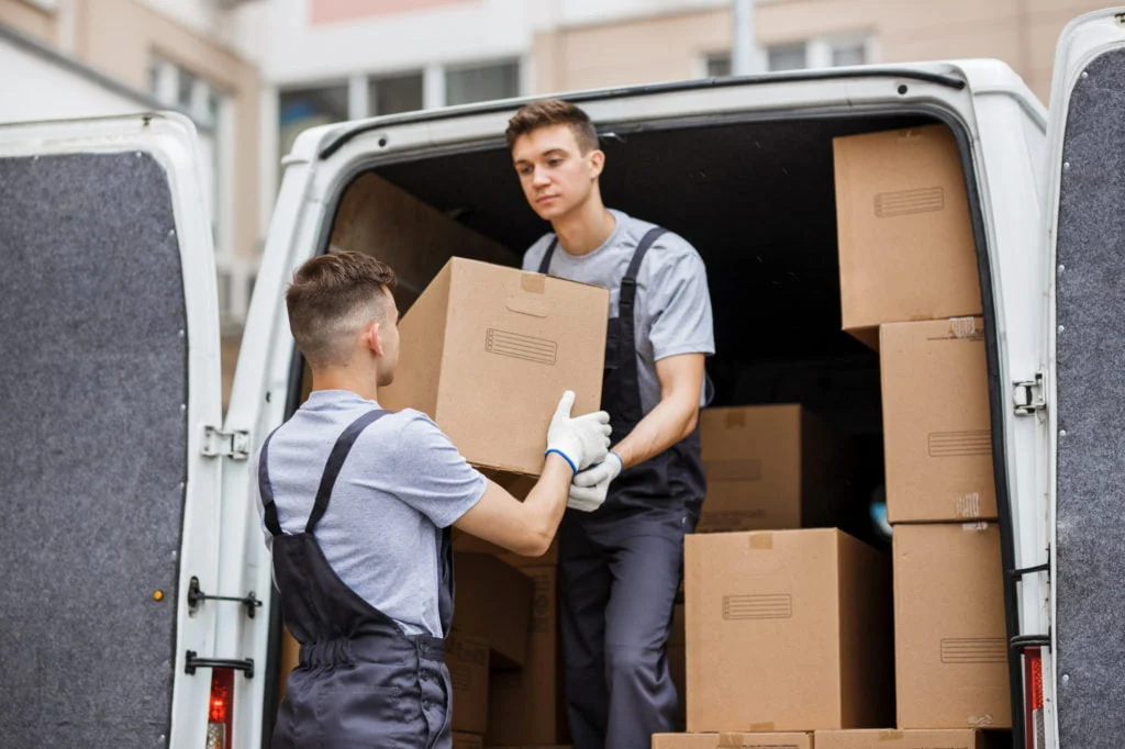 Moovers Chicago – Expert Moving Services Professional movers loading boxes into a van for Moovers Chicago.
