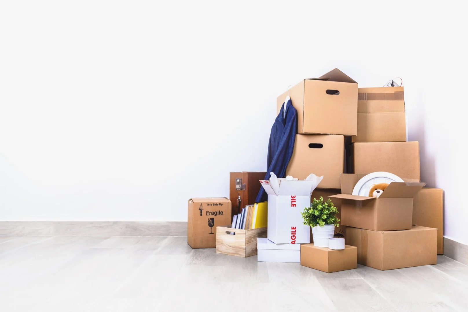 Chicago Movers – Efficient Moving Services Stack of moving boxes and household items for Chicago movers.