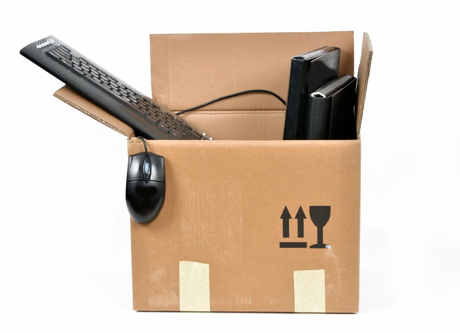 Office Moving Services in Chicago Office supplies packed in a box for moving services in Chicago.