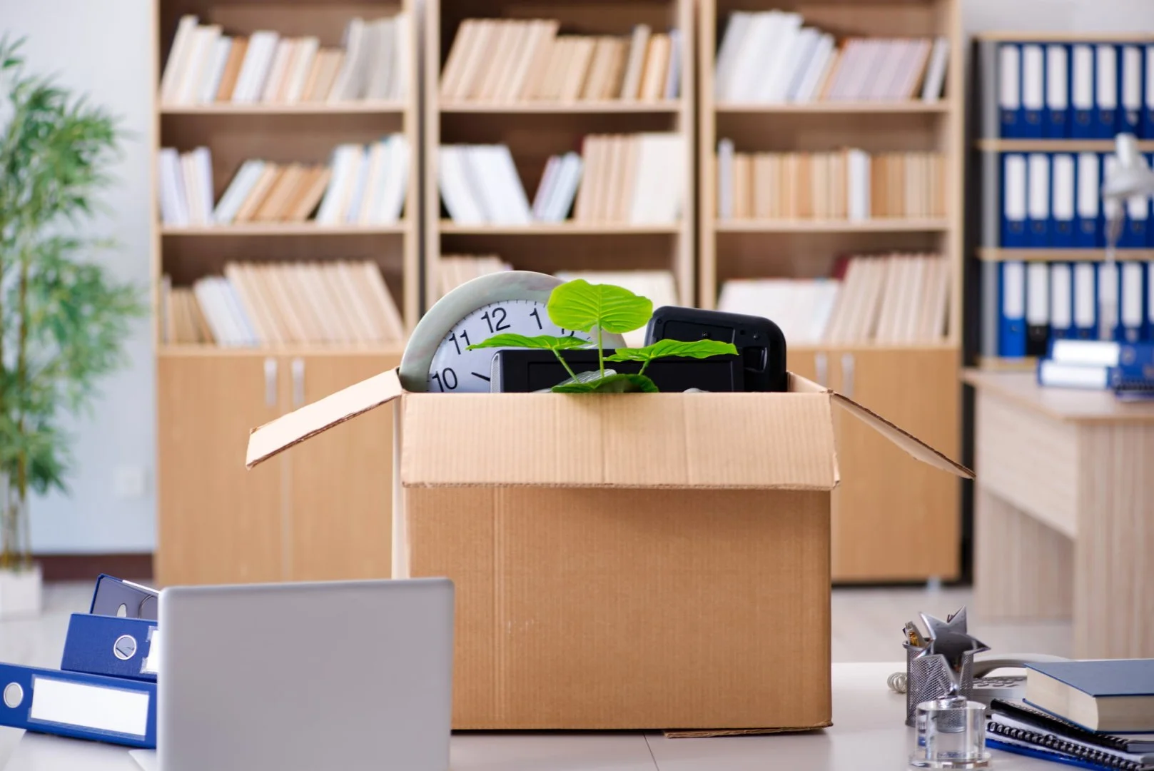 Office Move by Moovers Chicago Office move with packed box and clock, Moovers Chicago.