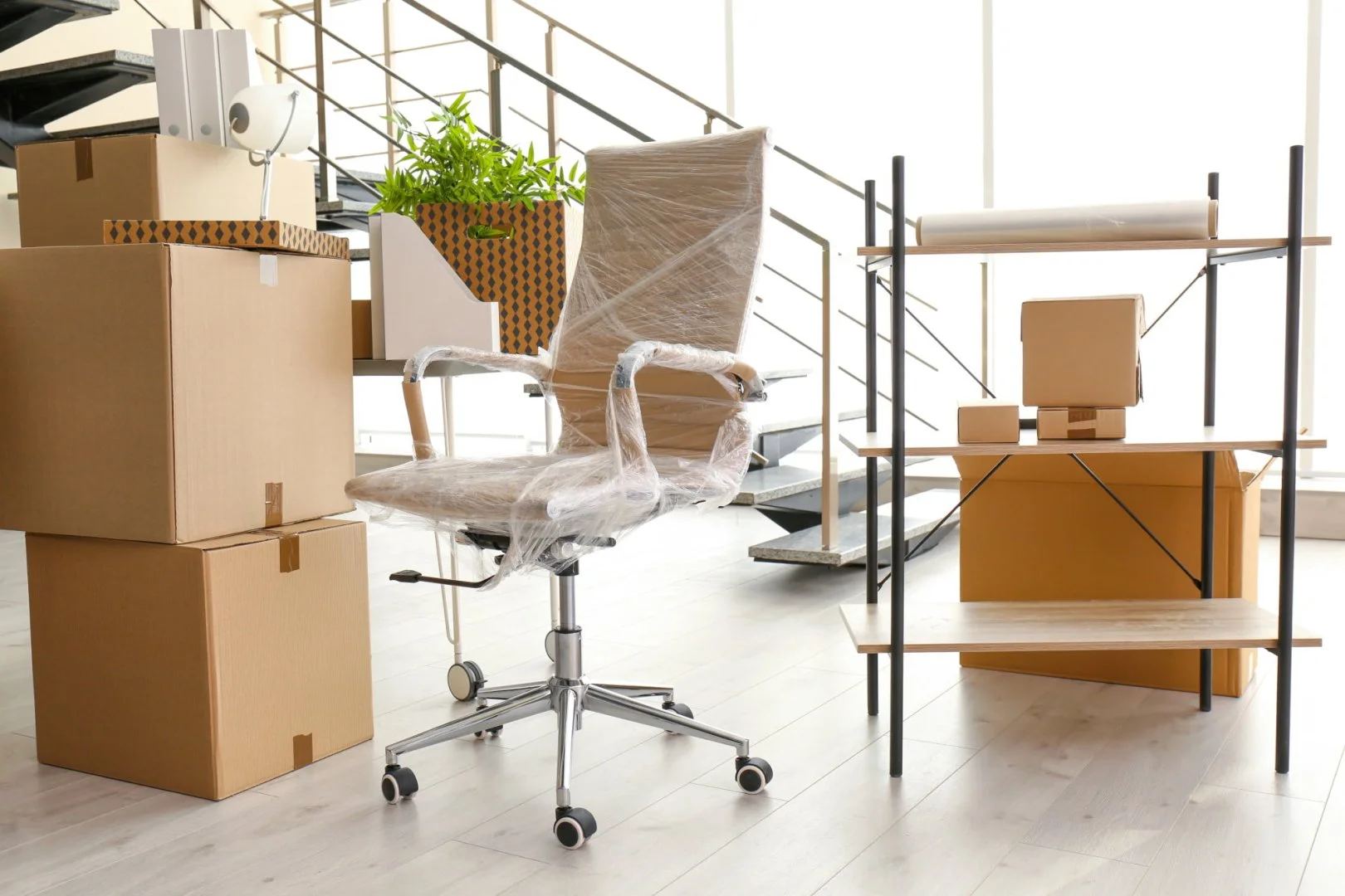 Office Moving Setup Office moving setup with packed boxes and chair by Moovers Chicago.