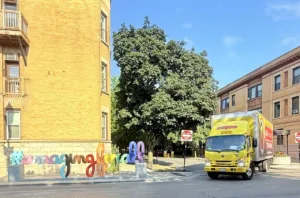 Moovers Chicago truck parked in a city neighborhood, offering local and long distance moving services.