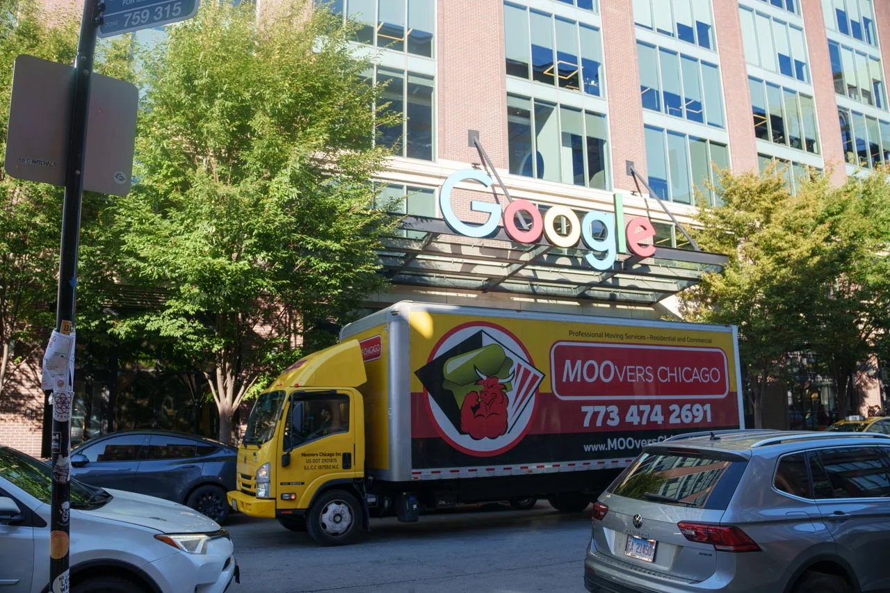 Moovers Chicago Truck at Google Building Moovers Chicago truck parked in front of a building, offering local and long distance moving services.