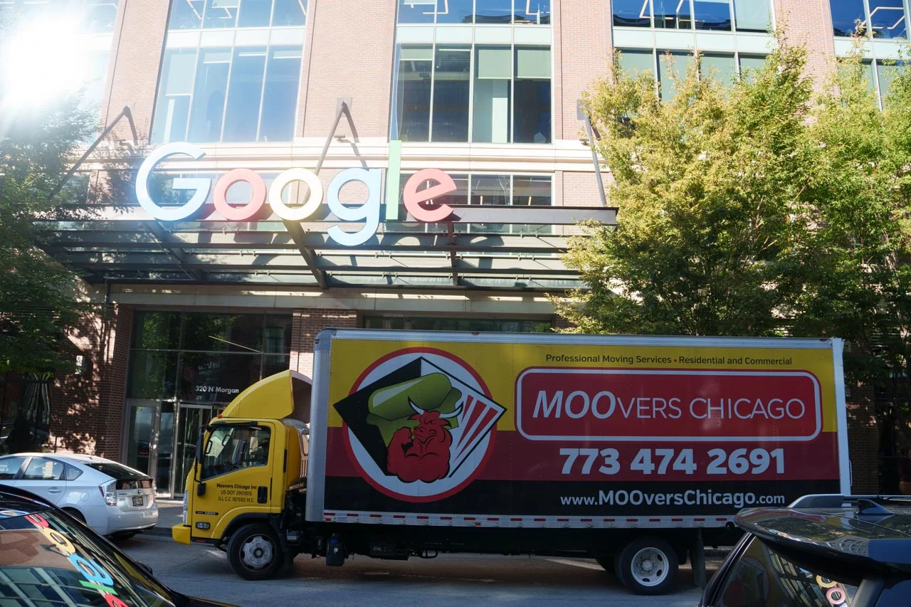 Moovers Chicago Truck at Google Building Moovers Chicago truck in West Loop parked in front of a building, offering professional moving services.