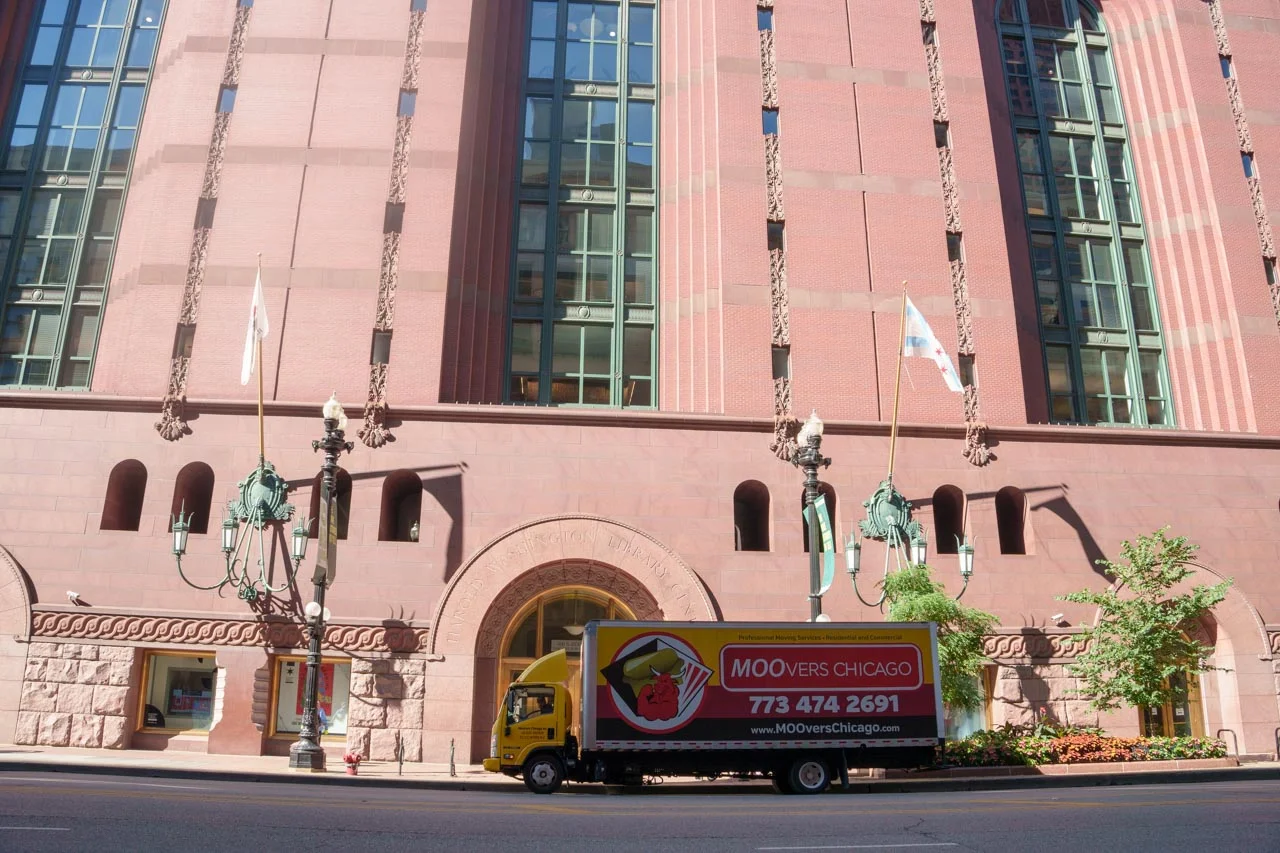 Moovers Chicago Truck in City Moovers Chicago truck parked in front of a building, local and long distance moving services.