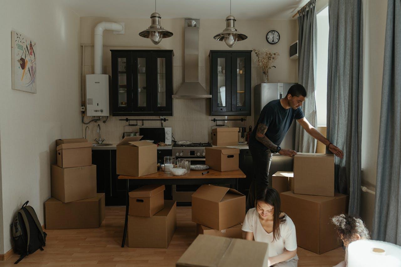 Family packing cardboard boxes