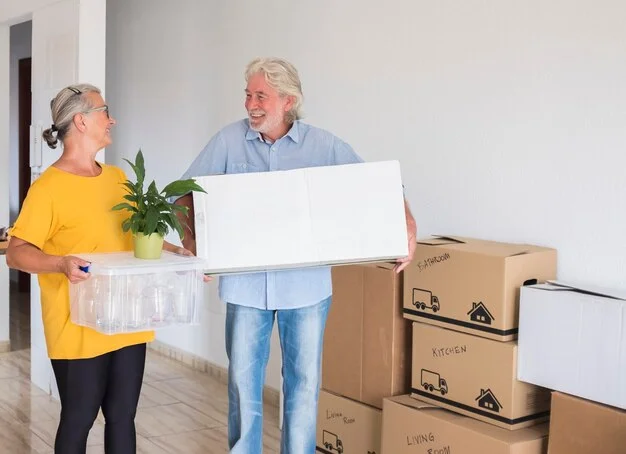 Senior Couple Moving with Moovers Chicago Senior couple moving boxes in their new home with Moovers Chicago.