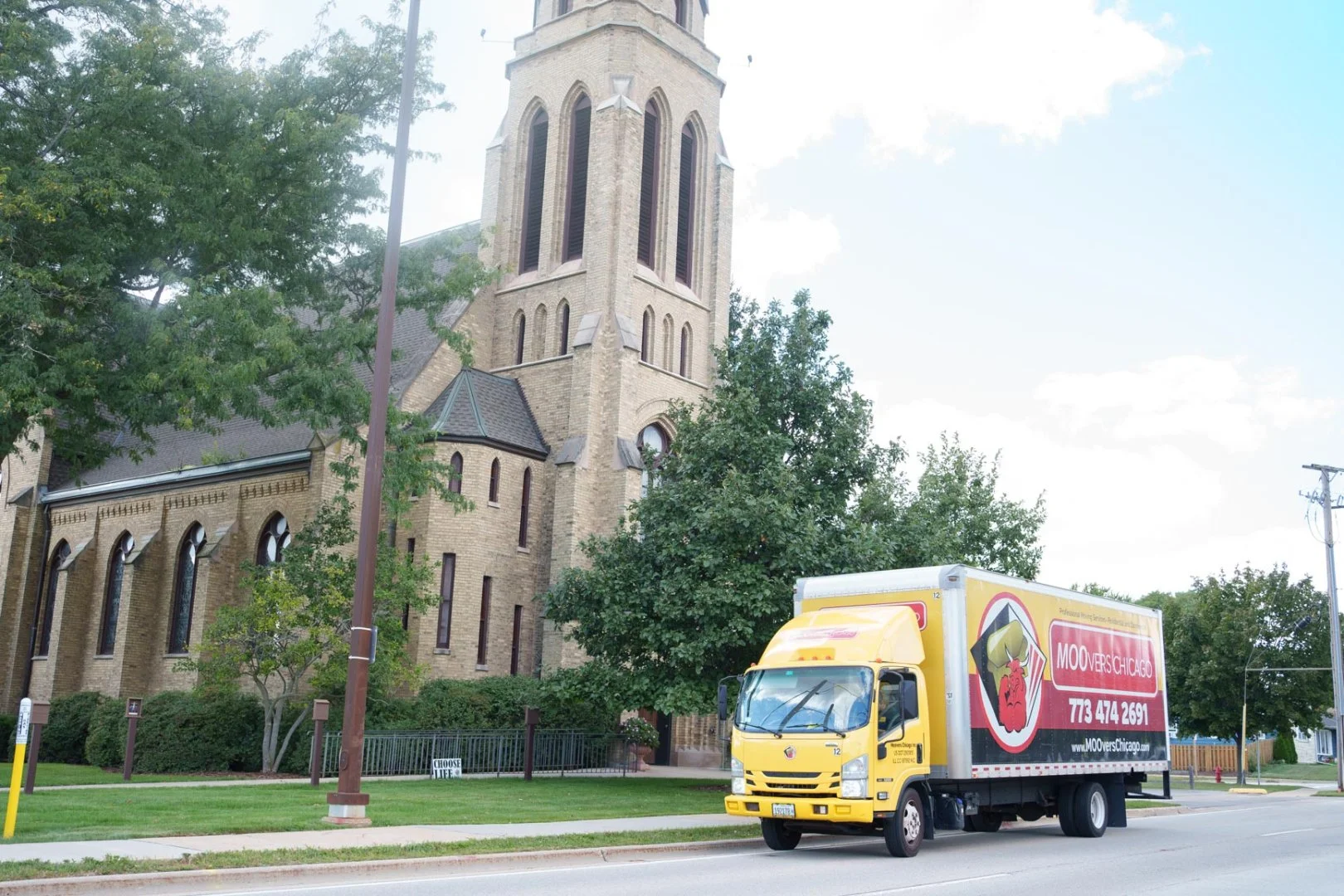 Moovers Chicago Moving Truck Moovers Chicago moving truck parked near a church, local and long distance moving services in Buffalo Grove, Illinois.