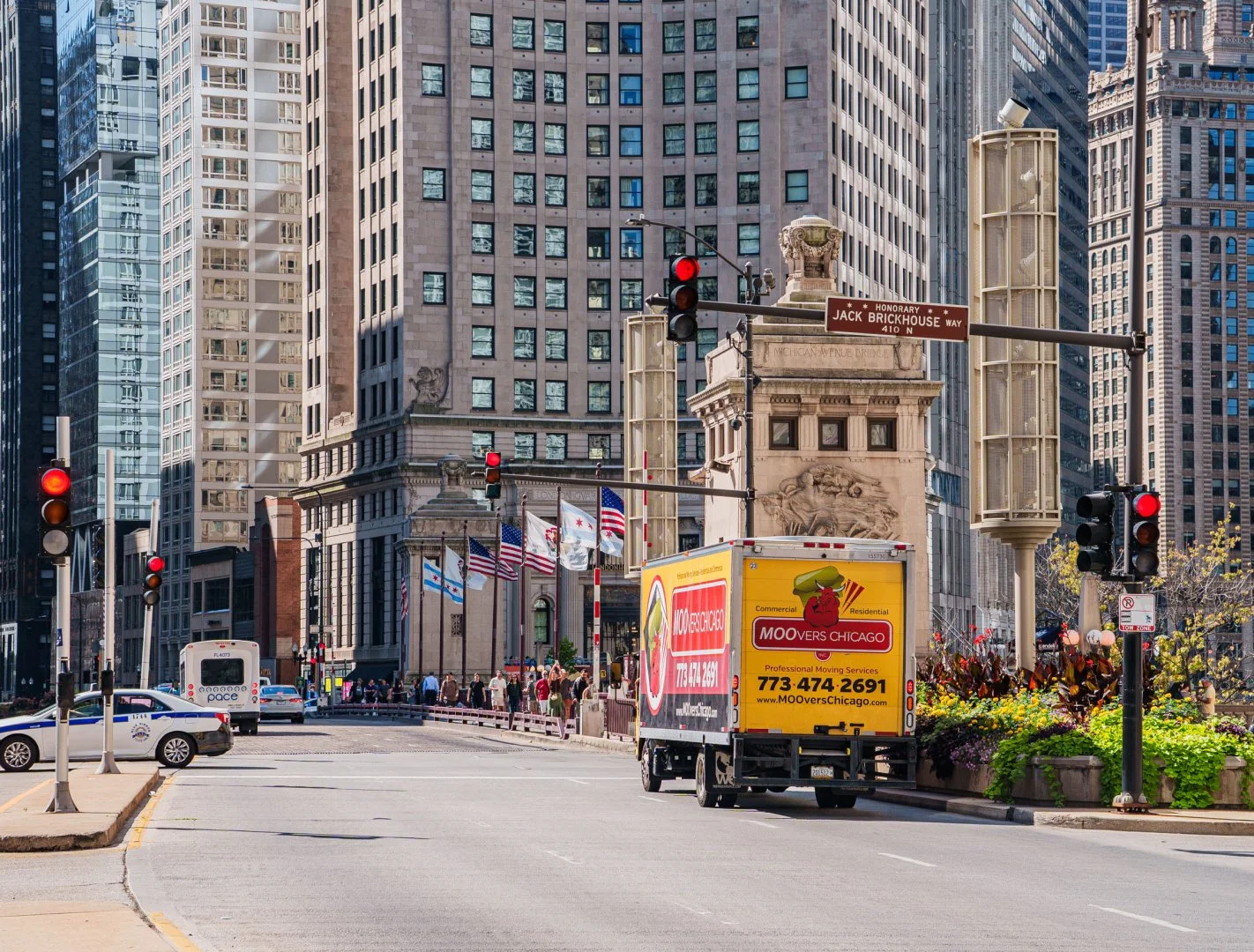 Moovers Chicago truck on a busy street, local and long distance moving services.