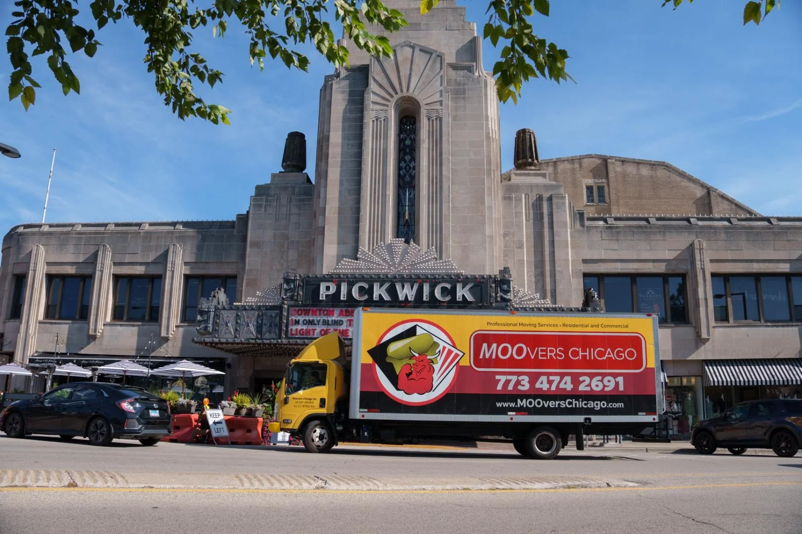 Moovers Chicago Truck at Pickwick Theatre Moovers Chicago truck in front of Pickwick Theatre in Park Ridge, IL, local and long distance moving services.