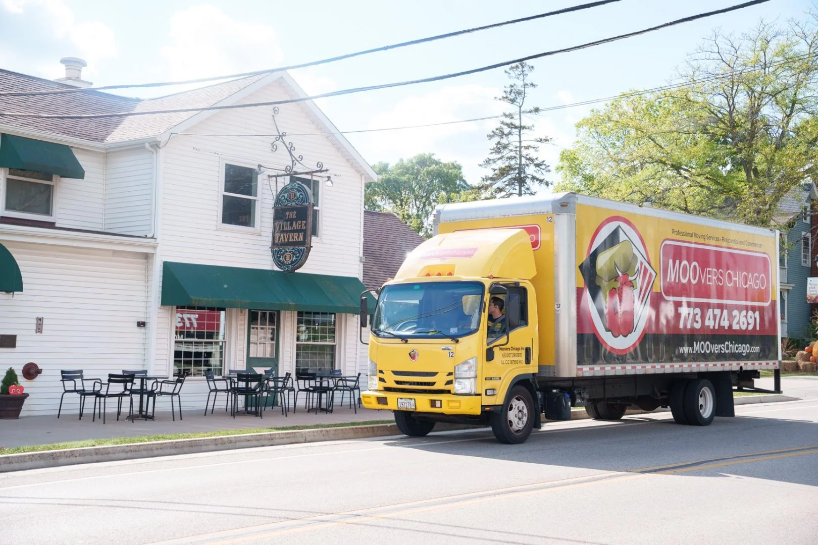 Moovers Chicago Truck at Restaurant Moovers Chicago truck parked in front of a restaurant, offering local and long distance moving services in Long Grove, IL.