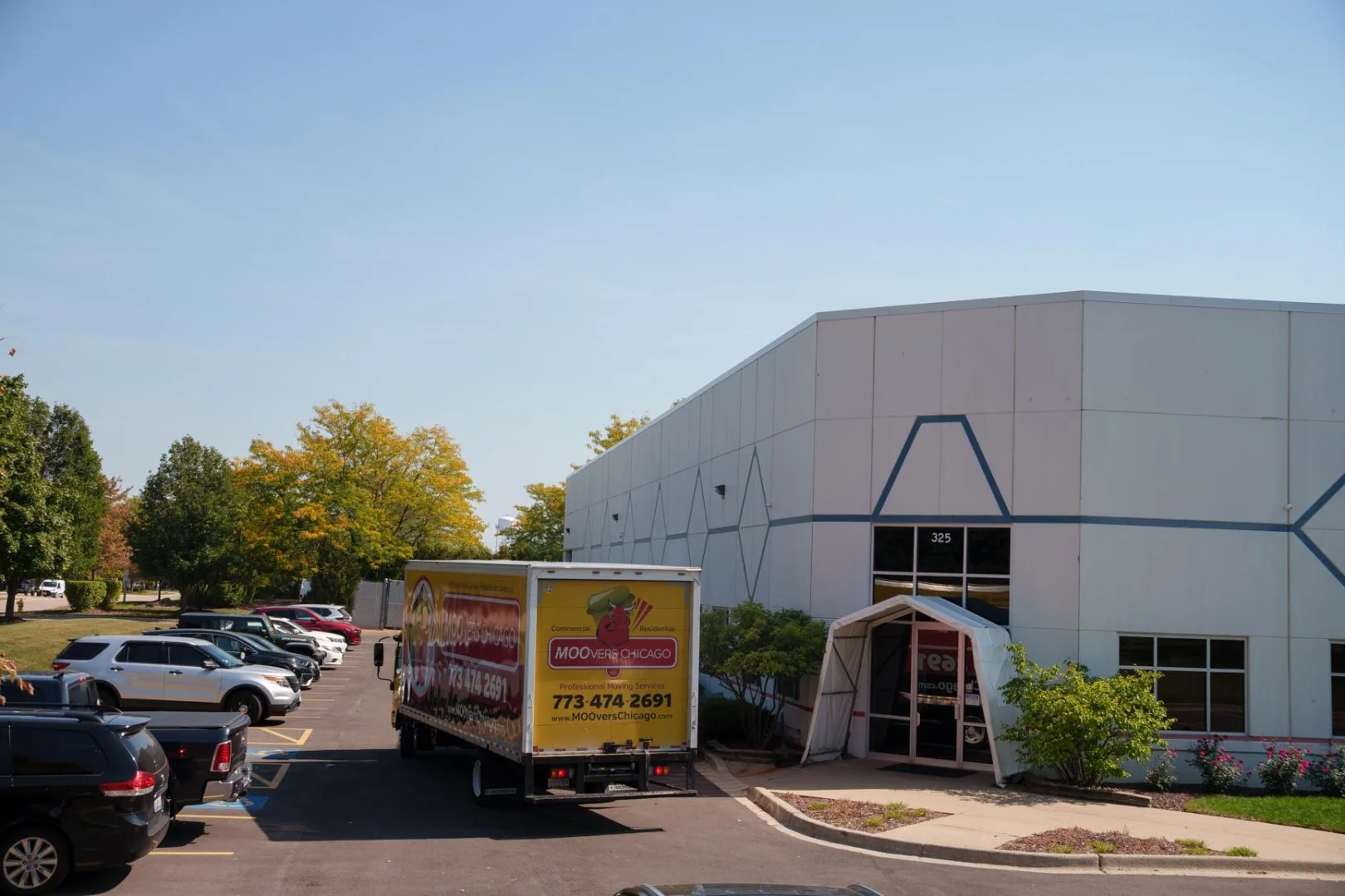 Moovers Chicago Truck at Commercial Site Moovers Chicago truck parked outside a commercial building, local and long distance moving services in Glendale Heights, IL.