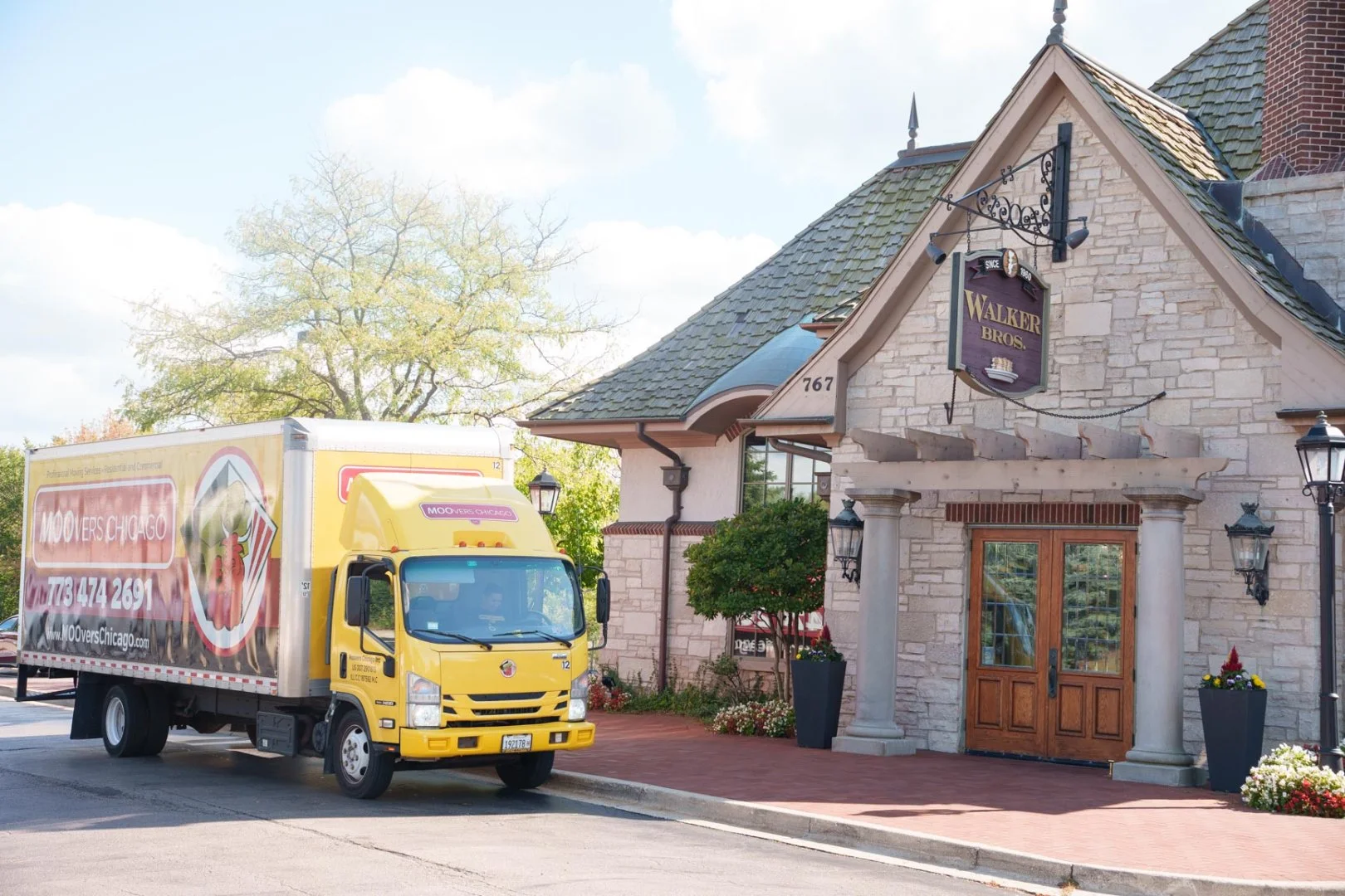 Moovers Chicago Truck at Historic Building Moovers Chicago truck parked outside a building, offering local and long distance moving services in Lake Zurich, IL.