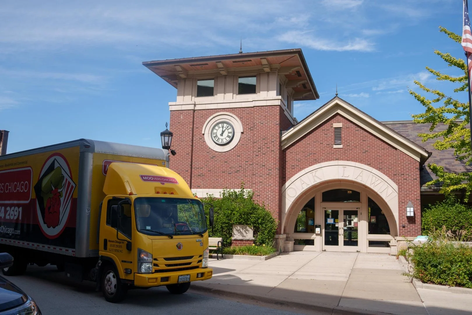 Moovers Chicago Truck at Oak Lawn Moovers Chicago truck parked in front of a building, offering local and long distance moving services.