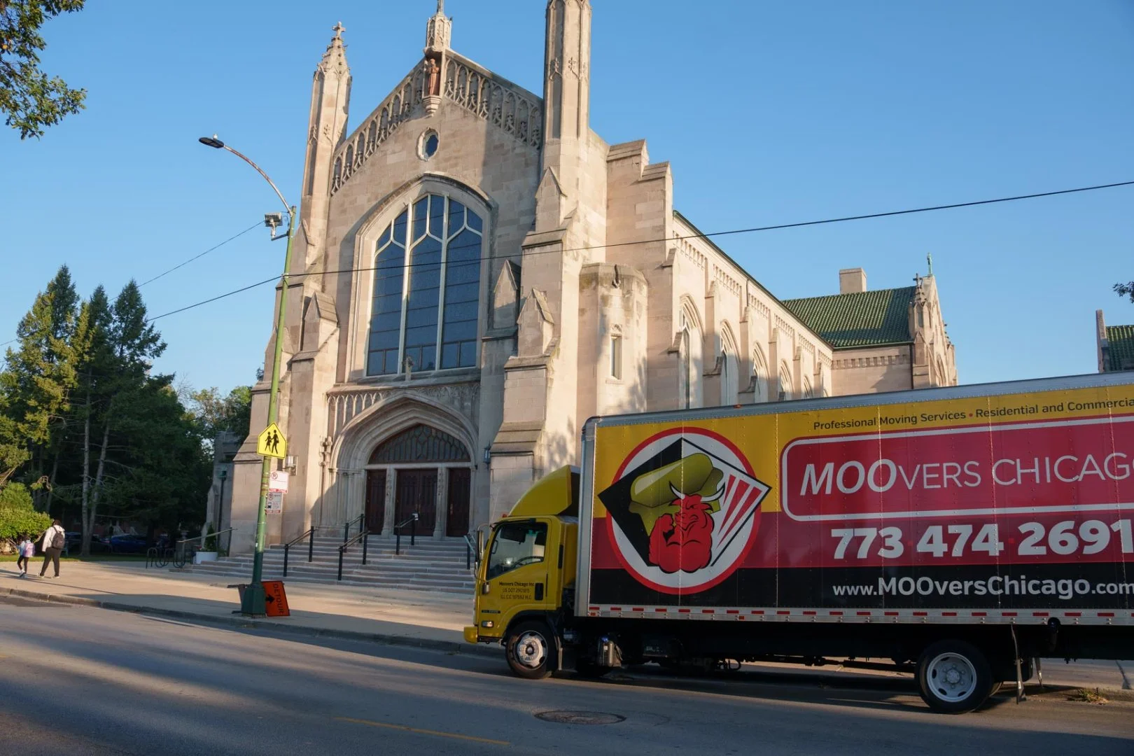 Moovers Chicago Truck Near Church Moovers Chicago truck parked near a church, offering moving services in Chicago.