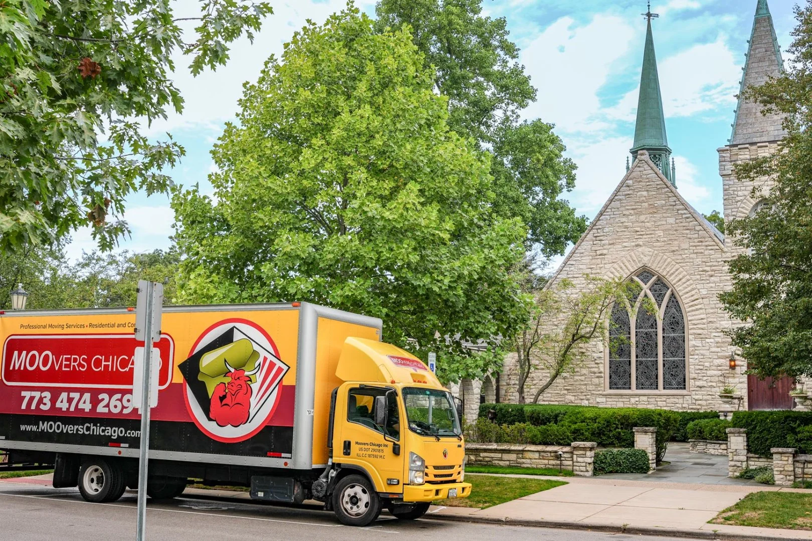 Moovers Chicago Truck Moovers Chicago truck parked near a church, offering local and long distance moving services in Kenilworth, IL.