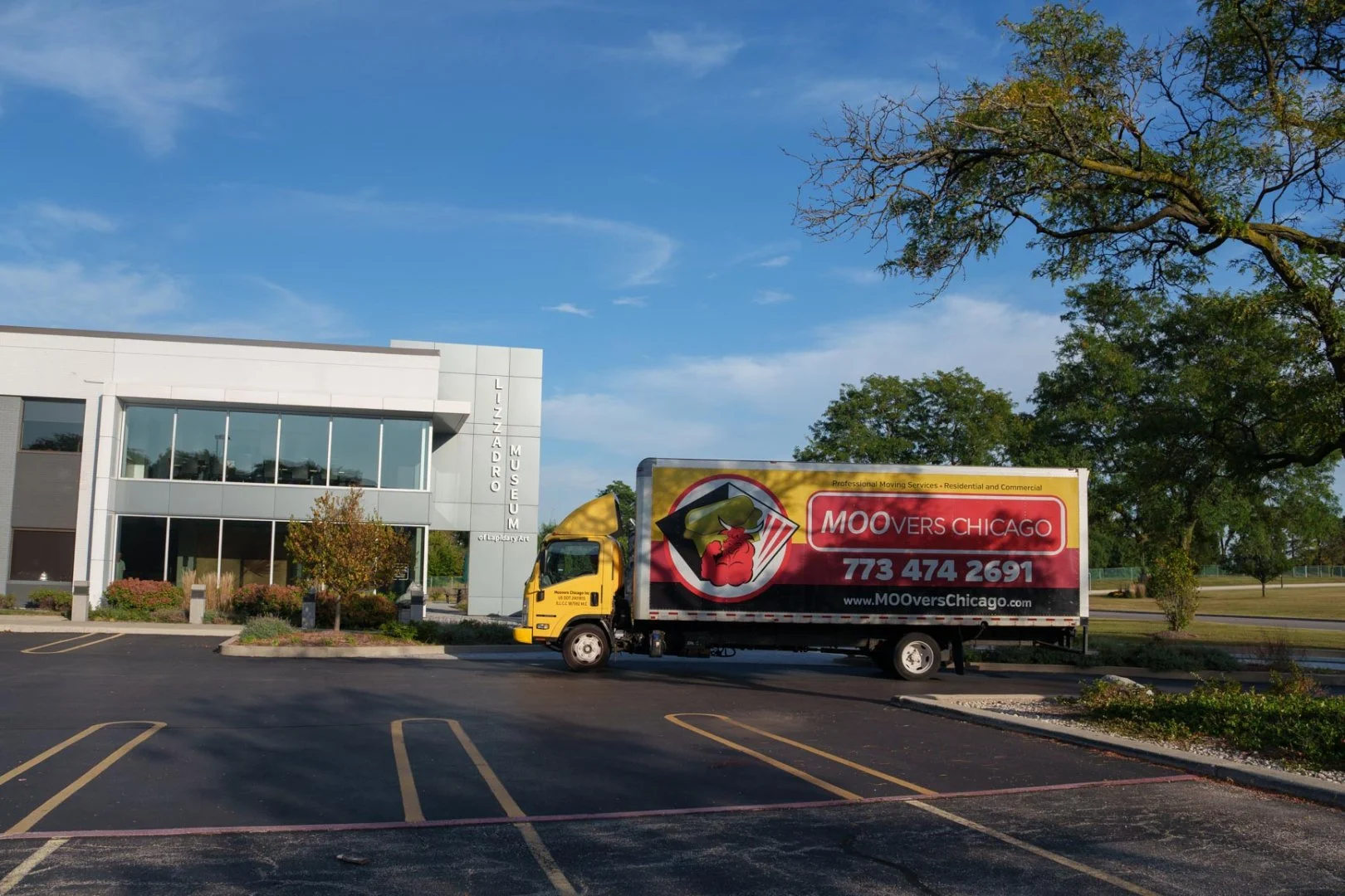 Moovers Chicago Truck Outside Building Moovers Chicago truck parked outside a building, local and long distance moving services in Oak Brook, IL.