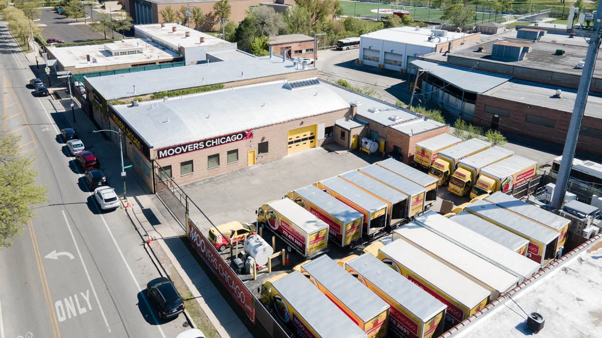 Moovers Chicago facility with moving trucks ready for local and long distance moves.