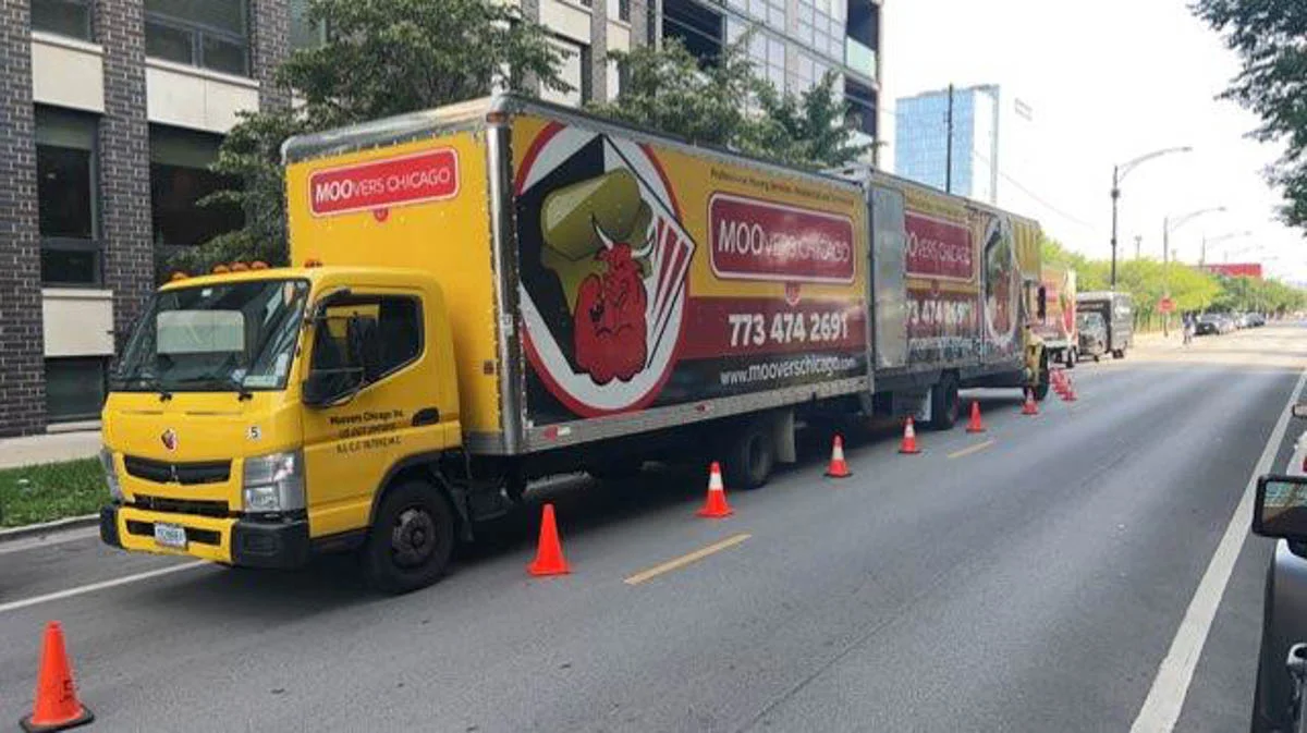 Moovers Chicago Moving Trucks Moovers Chicago moving trucks parked on a city street.