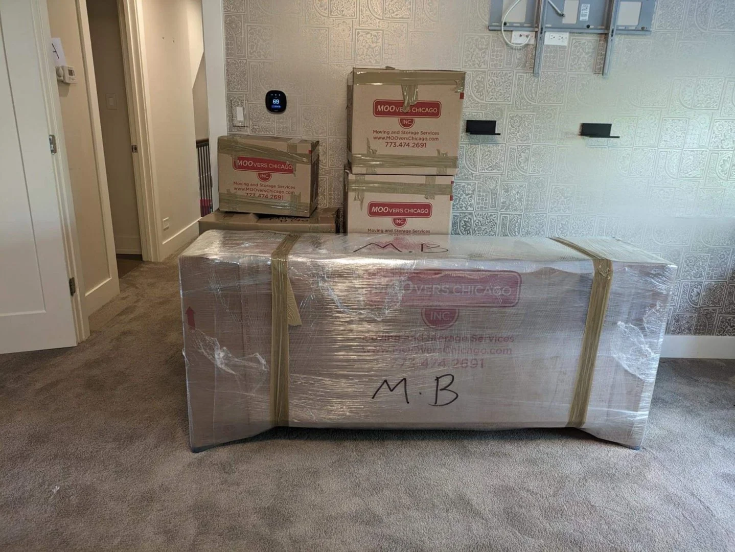 Moovers Chicago Packing Services Moovers Chicago packing services with labeled boxes in a room.