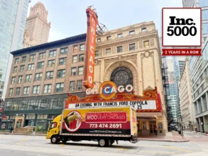 Moovers Chicago truck in front of iconic Chicago theater.