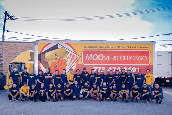 Moovers Chicago team in front of moving truck offering residential and commercial moving services.