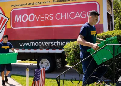 Moovers Chicago truck with movers carrying boxes, local and long distance moving services.