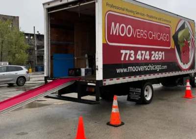 Moovers Chicago truck in parking space, ready for loading, offering local and long distance moving services.