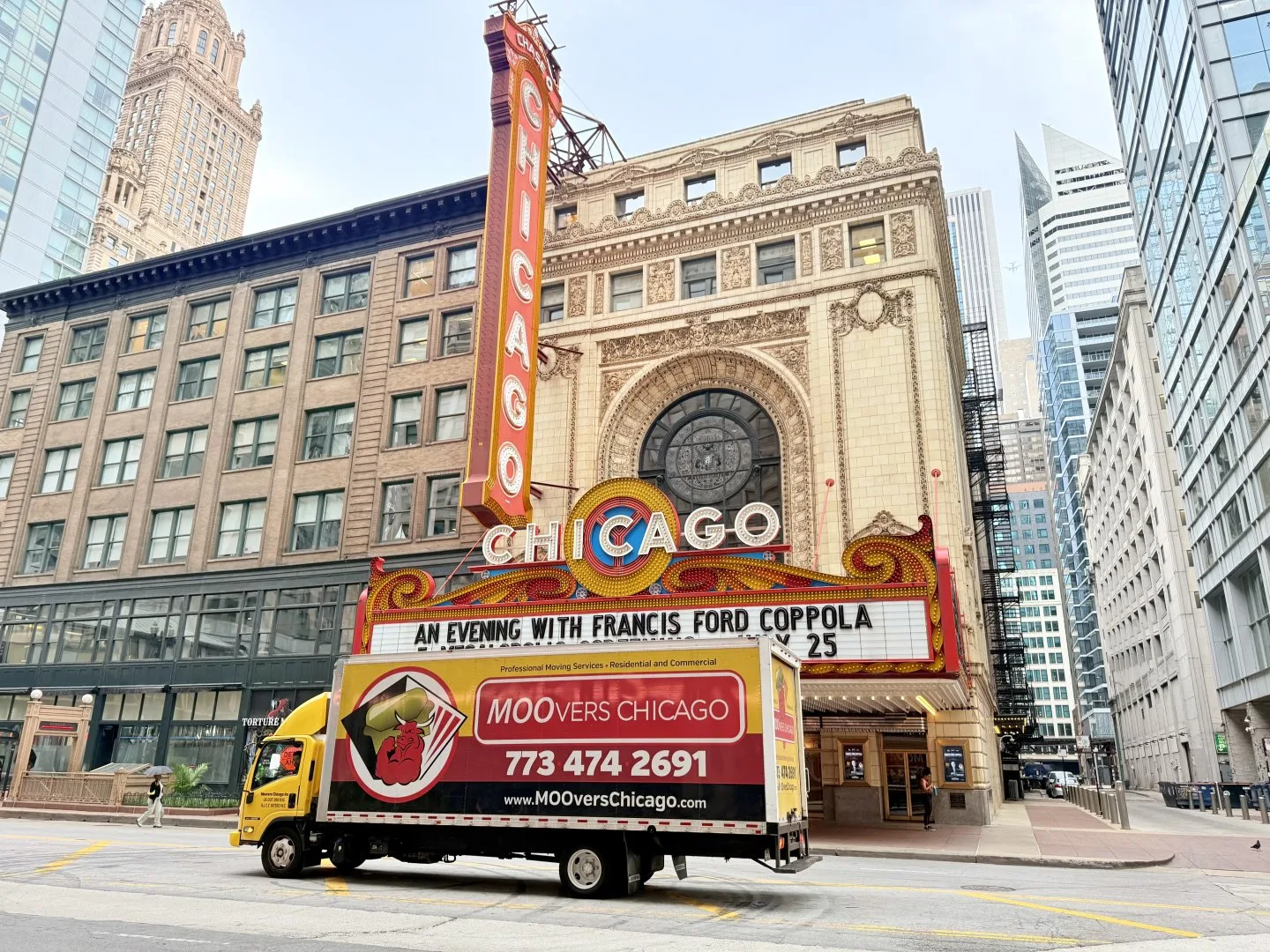 Moovers Chicago truck in front of Chicago Theater, local and long distance moving services.