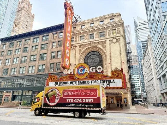 Moovers Chicago truck in front of iconic theater, local and long distance moving services.