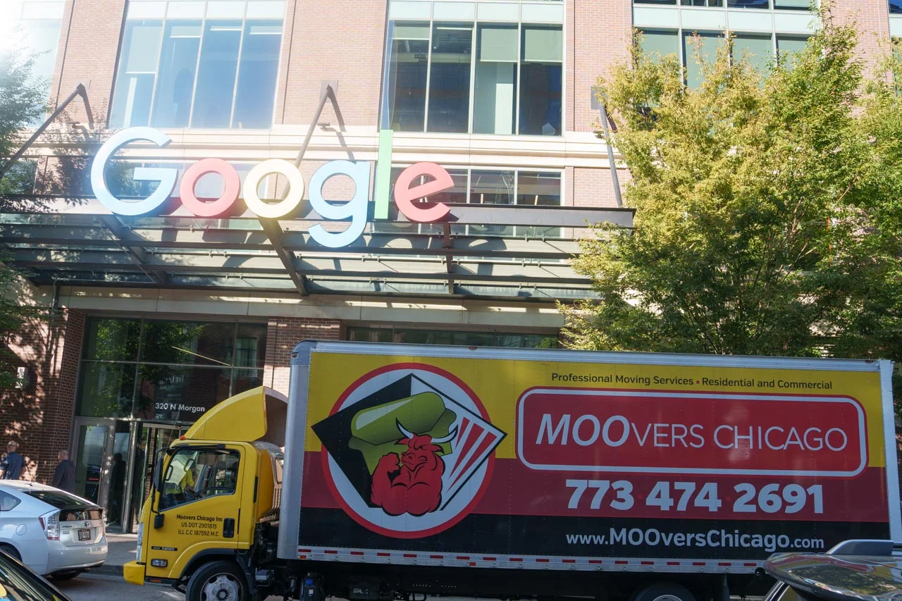 Moovers Chicago truck parked in front of Google building, local and long distance moving services.