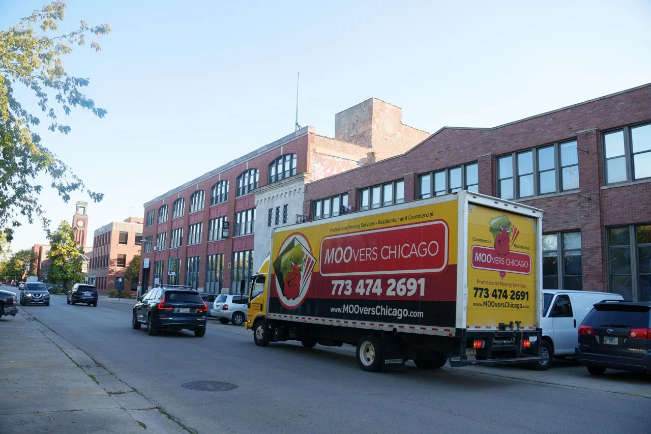 Moovers Chicago truck parked on a street, offering local and long distance moving services.