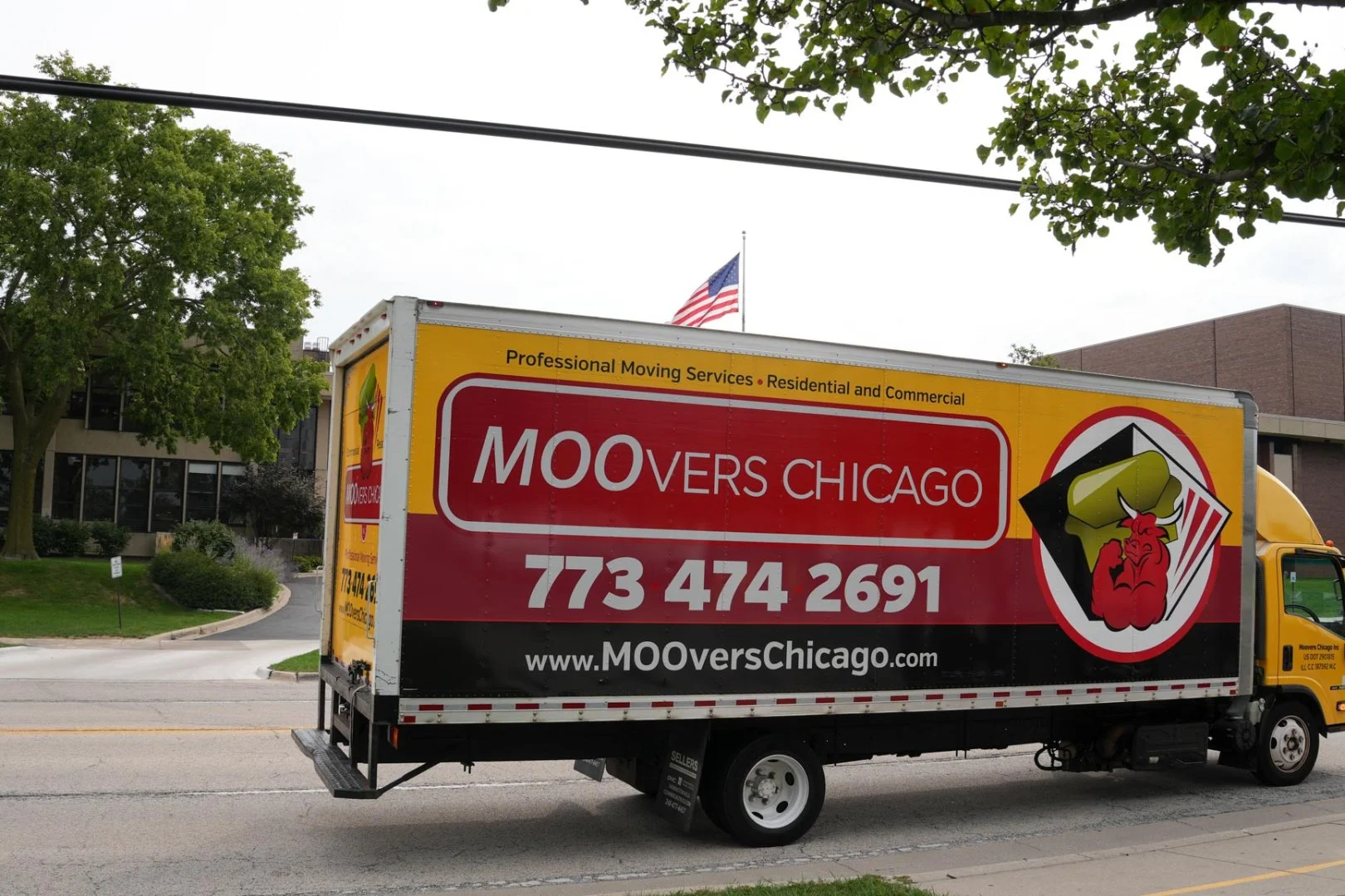 Moovers Chicago moving truck on a street, offering local and long distance moving services.