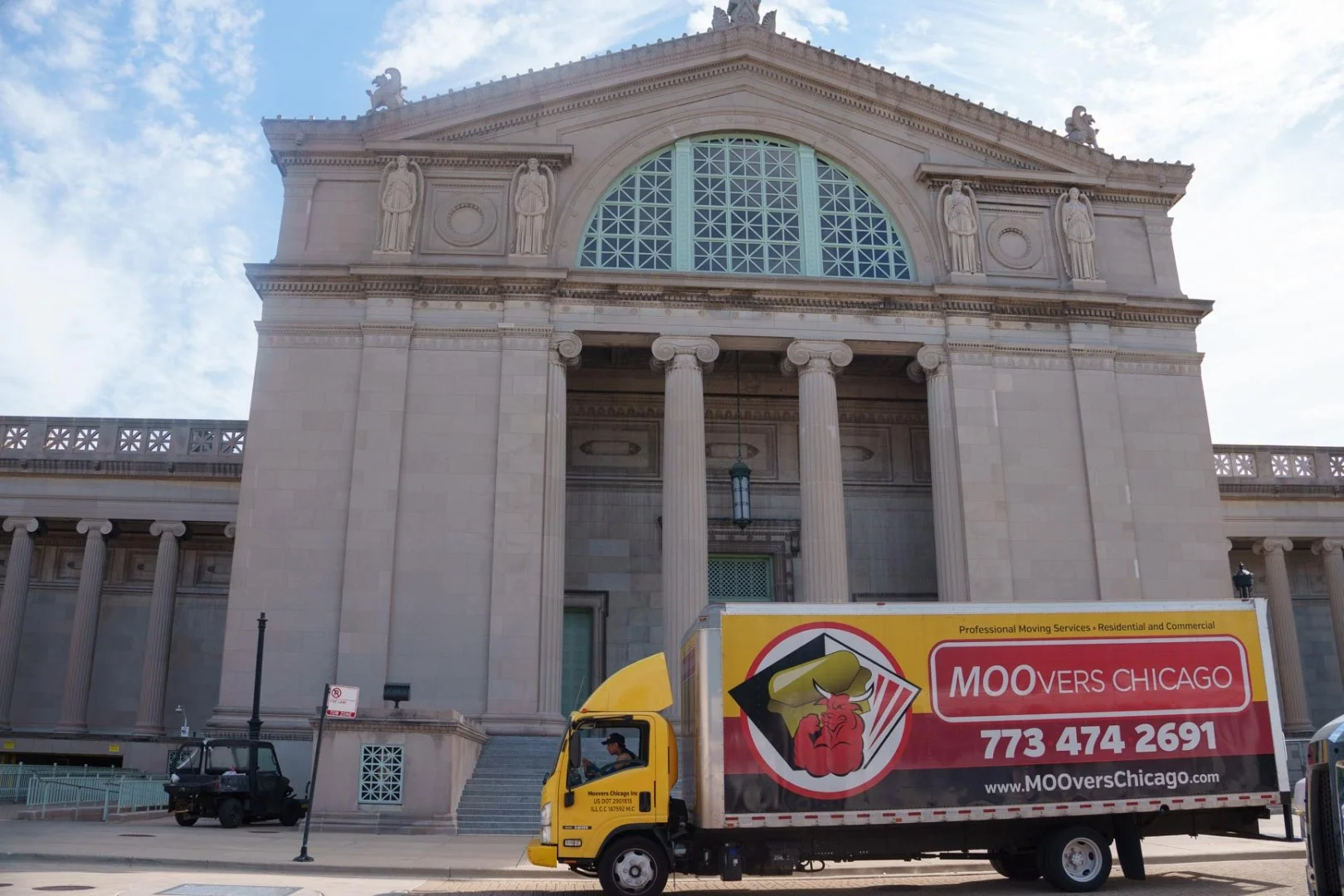 Moovers Chicago truck in front of a historic building, offering local and long distance moving services in Hyde Park.