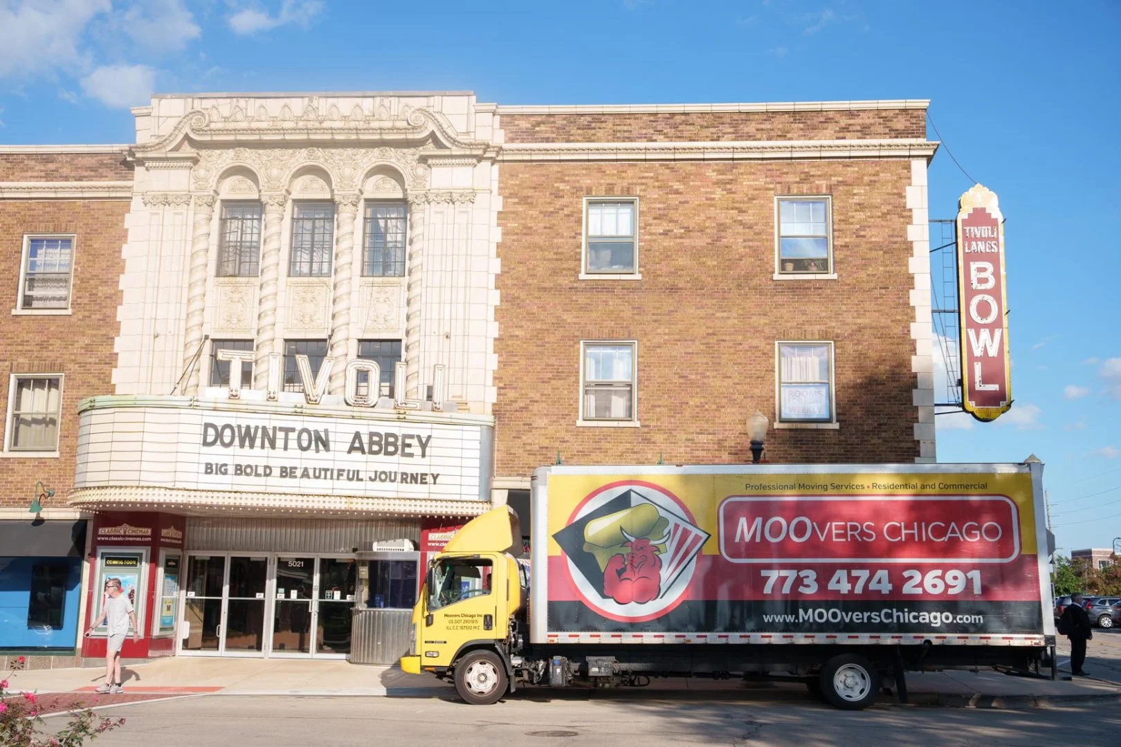 Moovers Chicago truck in front of Tivoli building, local and long distance moving services in Downers Grove, IL.