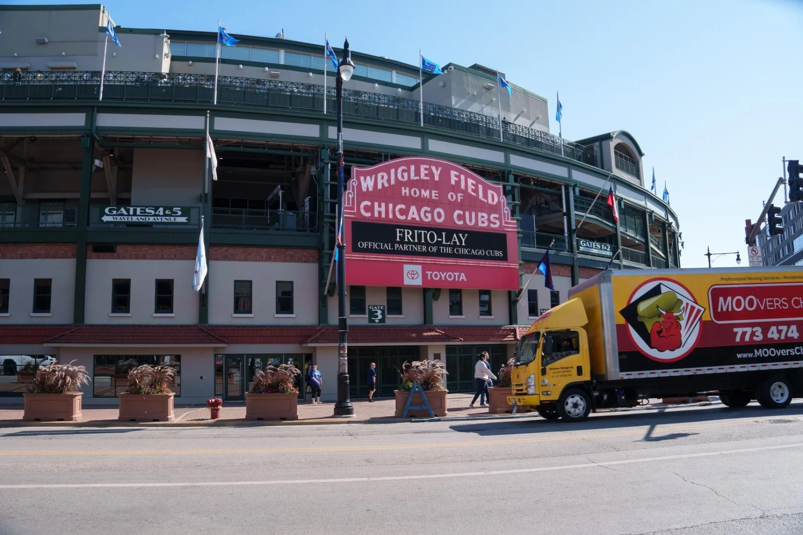 Moovers Chicago truck in front of Wrigley Field, local and long distance moving services.