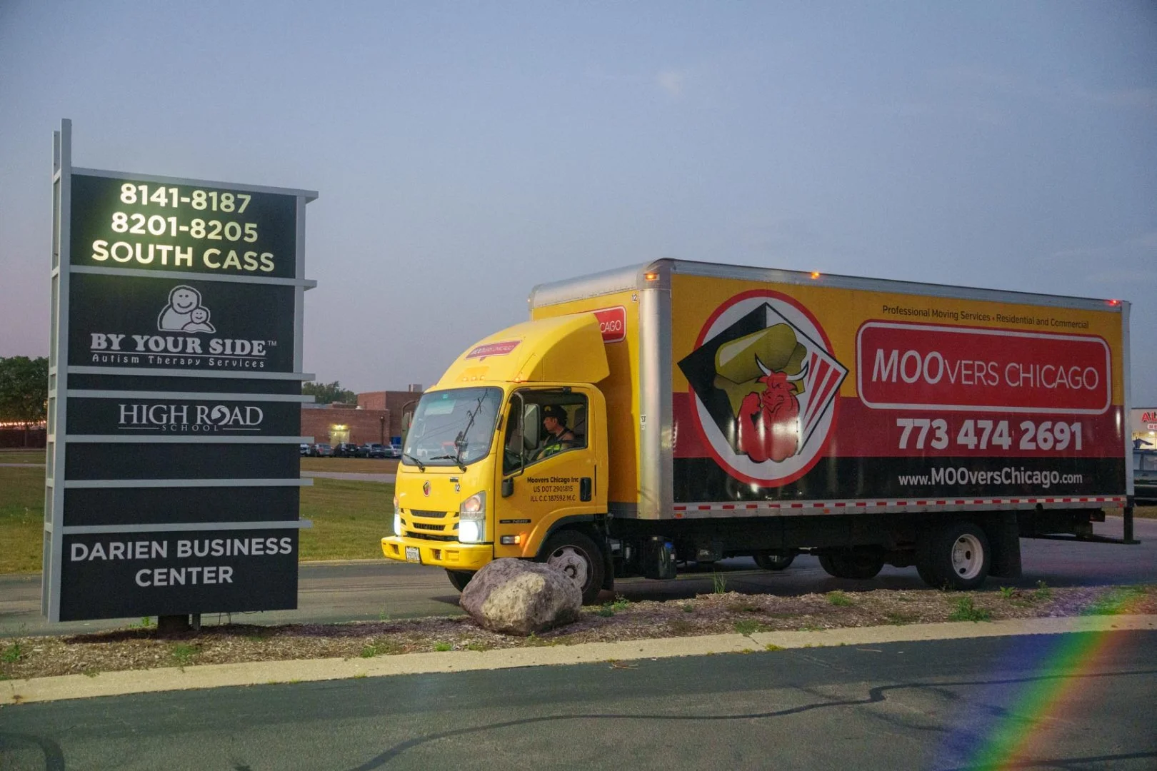 Moovers Chicago truck parked at Darien Business Center, IL, offering local and long-distance moving services.