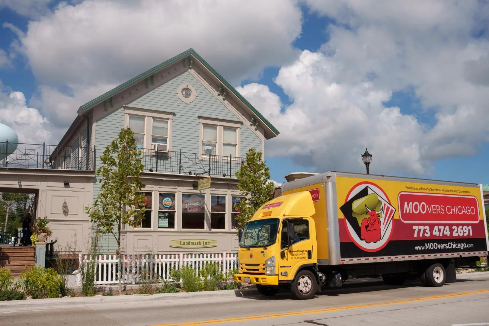 Moovers Chicago truck parked in front of a building in Northbrook, IL, offering local and long distance moving services.