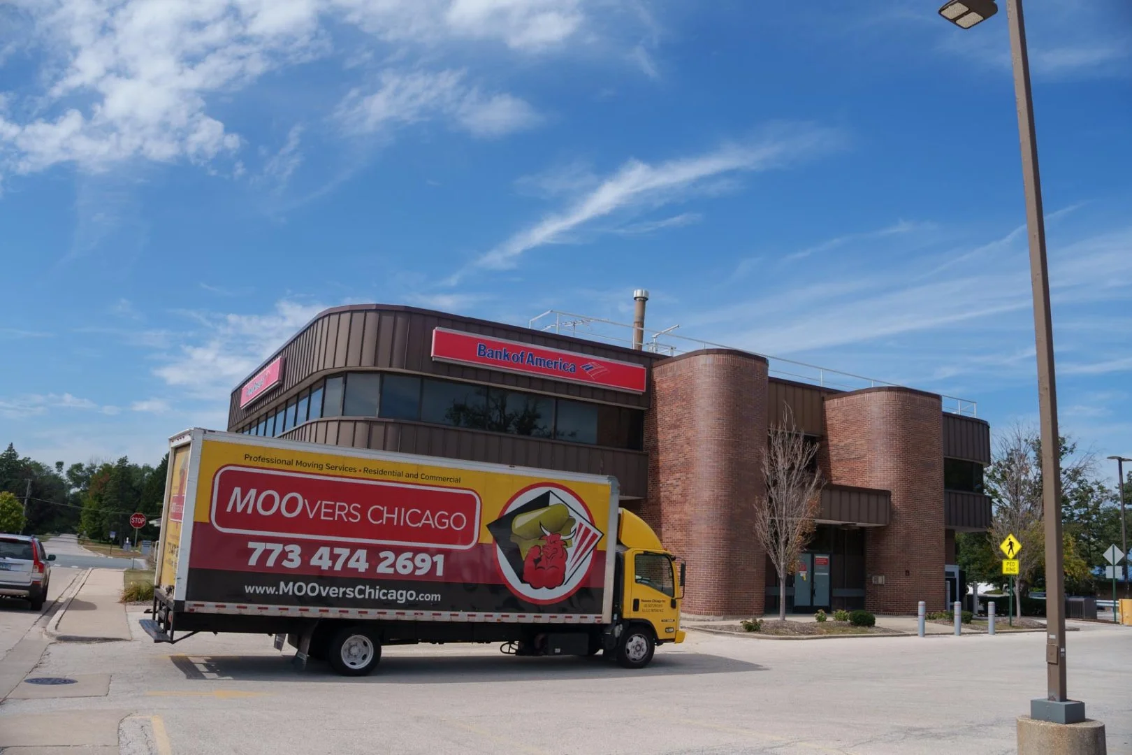 Moovers Chicago truck parked in front of a building, offering local and long distance moving services in Prospect Heights, IL.