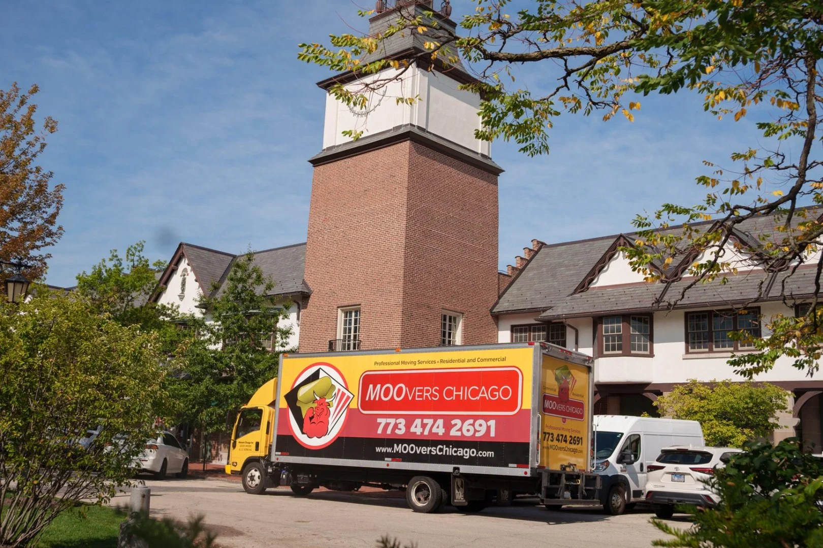 Moovers Chicago truck parked in front of a building, offering local and long-distance moving services in Lake Forest, IL.