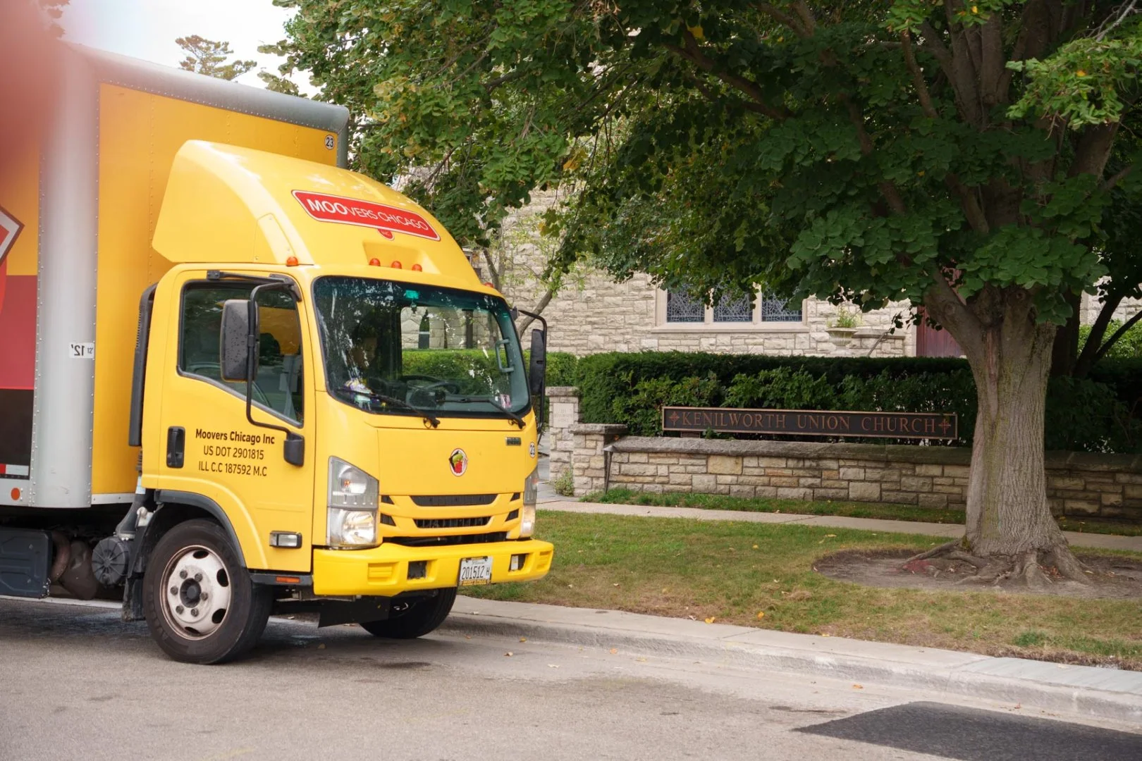 Moovers Chicago truck parked near Kenilworth Union Church in Illinois.