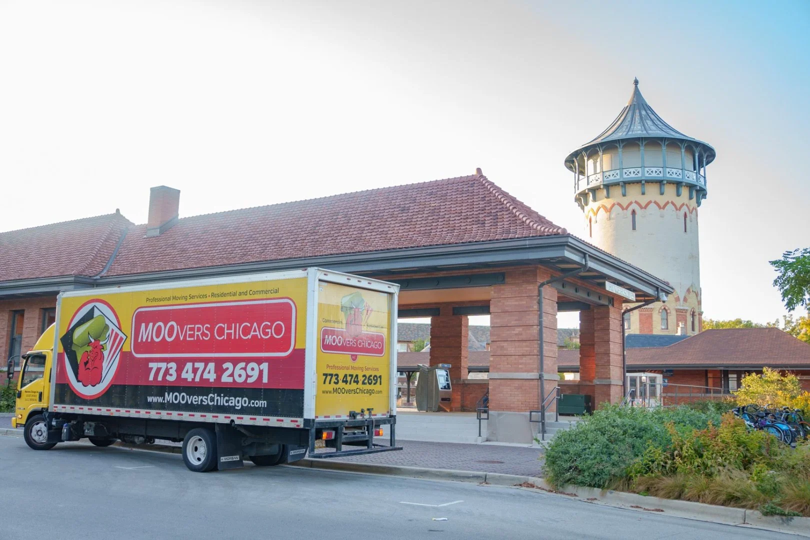 Moovers Chicago truck parked near a historic building, offering local and long distance moving services Riverside, Illinois.