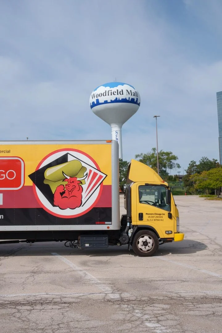 Moovers Chicago truck parked near Woodfield Mall, offering local and long distance moving services in Schaumburg, IL.