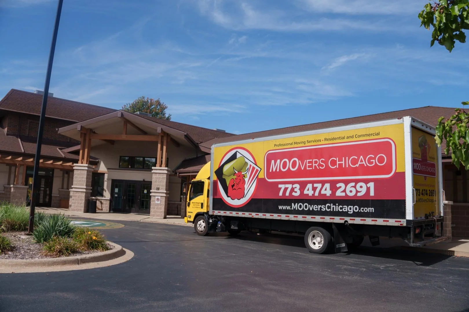 Moovers Chicago truck parked outside a Palos Heightsbuilding, offering local and long distance moving services.