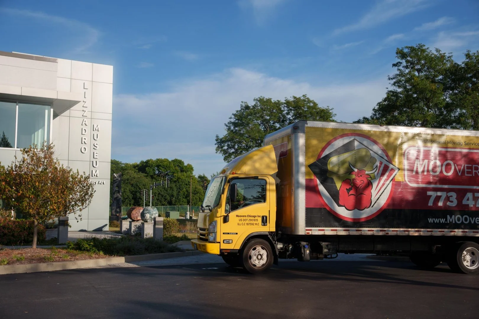 Moovers Chicago truck parked outside a museum, offering local and long distance moving services in Oak Brook, IL.